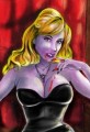 Sexy Female Vampire Sitting in a Chair